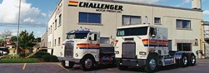 Old Challenger building and trucks