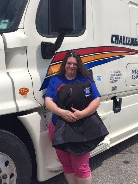 Tina Powell Challenger Motor Freight Driver Standing Beside Her Truck